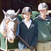 Addie Browne (left) with Shasta and trainer Tommi Clark get ready to show at the Gold Coast hunter/jumper series.