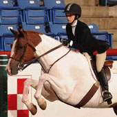 Ashley Wildes and Heza Texas Hobo win reserve in Hunt Seat Equitation Over Fences 18 & Under.