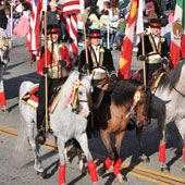 Amigos de Anza Equestrian Drill Team members ride in the 2010 Rose Parade.
