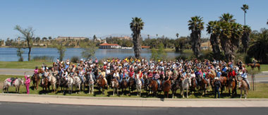 More than 200 riders pose for the 10th Anniversary of the Pedley Field photo at the Founder’s Day Ride May 1.