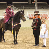 Beau and rider Lauren LaVine pose after winning the Part Bred Friesian Hunter Regional title Aug. 11-14.
