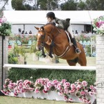 Samantha Sommers of Malibu soars to the USEF National Junior Hunter West Coast Finals title on Small Affair in competition July 22-23 at Showpark in Del Mar. She also took reserve on Illusion. 