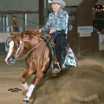Kelly Moran earns a saddle and buckle on Blaise, winning the Non Pro Futurity L4 and L3 crowns.