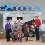 2014 CRHA Reiner of the Year Adina Valenzuela (holding buckle), along with her mount Zen Master, strike a championship pose with friends and associates.
